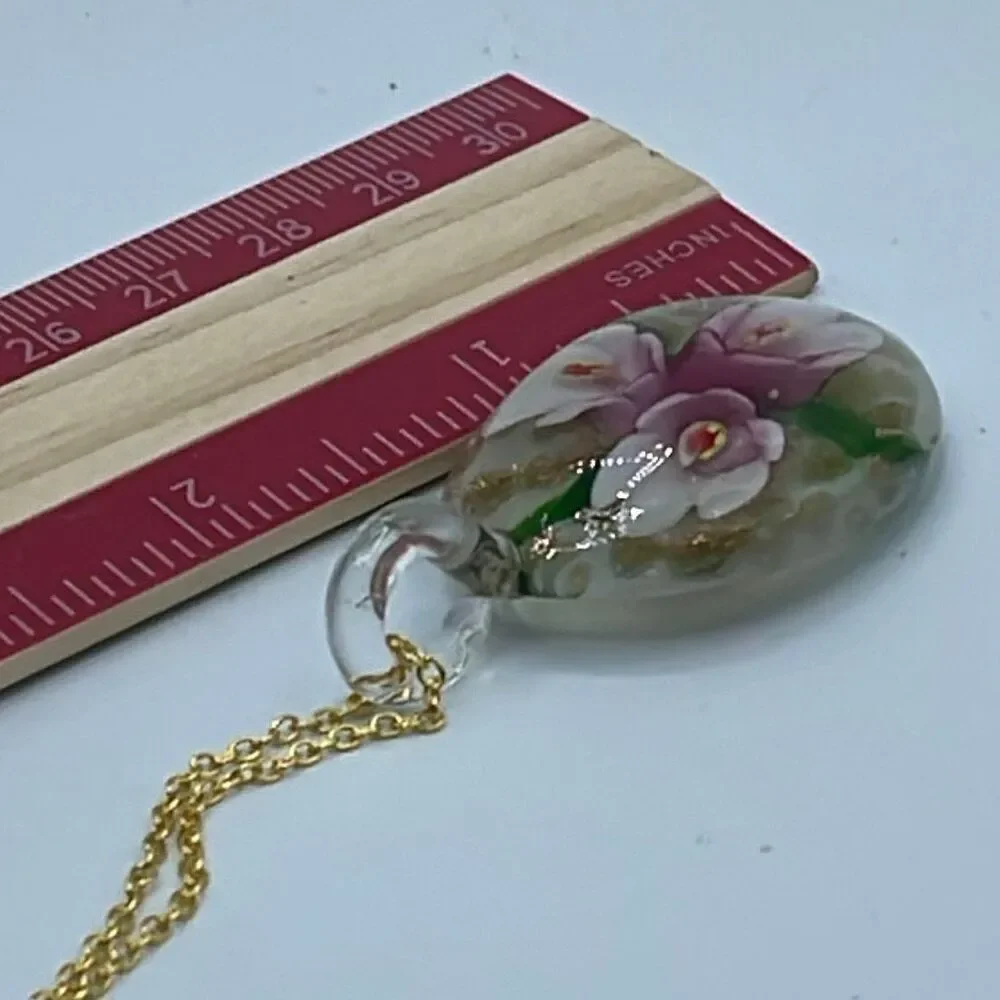Floral art glass pendant on a 925 plated gold chain.
